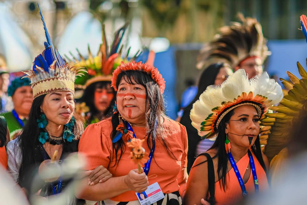 Joenia Wapichana (centre), Brazilian lawyer and former federal deputy, taking part in an Indigenous peoples’ demonstration at COP28 in Dubai (Image: Estevam Rafael / Palácio do Planalto, CC BY ND)