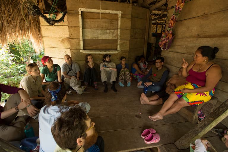 Emberá community member Omaira Casama (right) discusses the project with the McGill University team. Image courtesy of Smithsonian Tropical Research Institute (STRI).