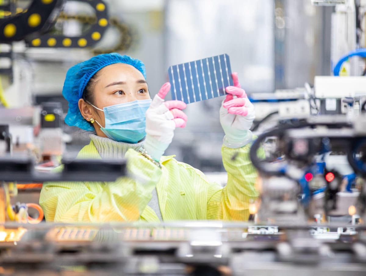 A worker produces photovoltaic modules at a factory in Nantong, Jiangsu province. Experts say that, despite scant official policy, businesses could still take actions to reduce gender imbalances, such as by disclosing gender data in environmental, social and governance (ESG) reports (Image: Zhai Huiyong / Costfoto / Sipa USA / Alamy)