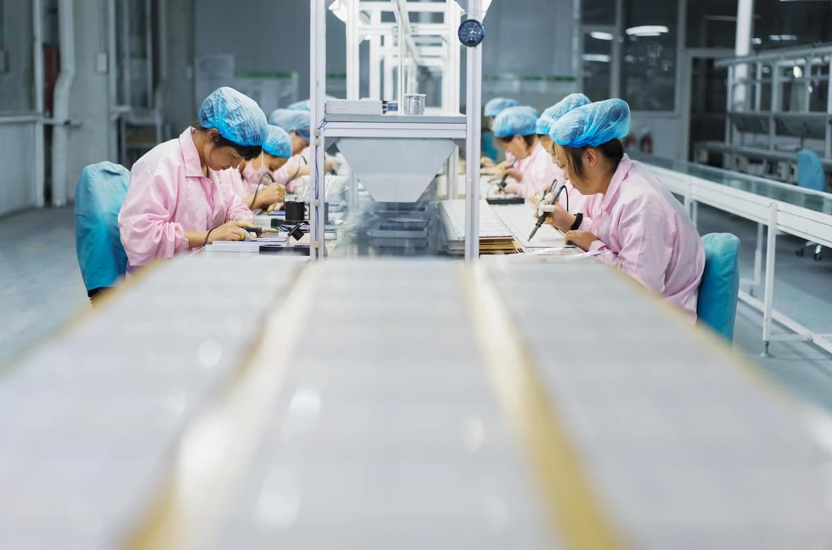 Workers in a solar panel assembly factory in the northeastern Chinese city of Dezhou, sometimes referred to as “China’s Solar City”. More Chinese firms are publishing ESG reports, and the availability of gender data is improving (Image: Mick Ryan / Connect Images / Alamy)