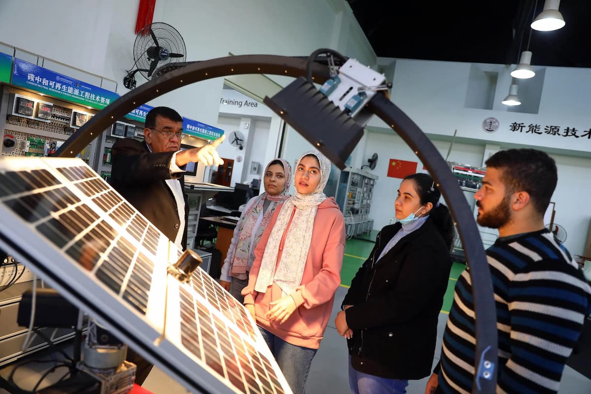 Students learn about hybrid renewable energy systems at the China-backed Luban Workshop at Ain Shams University in Cairo, Egypt. Researcher Frangton Chiyemura says cooperation between China and Africa in technological innovation can expand markets for Chinese new energy goods (Image: Ahmed Gomaa / Xinhua / Alamy)