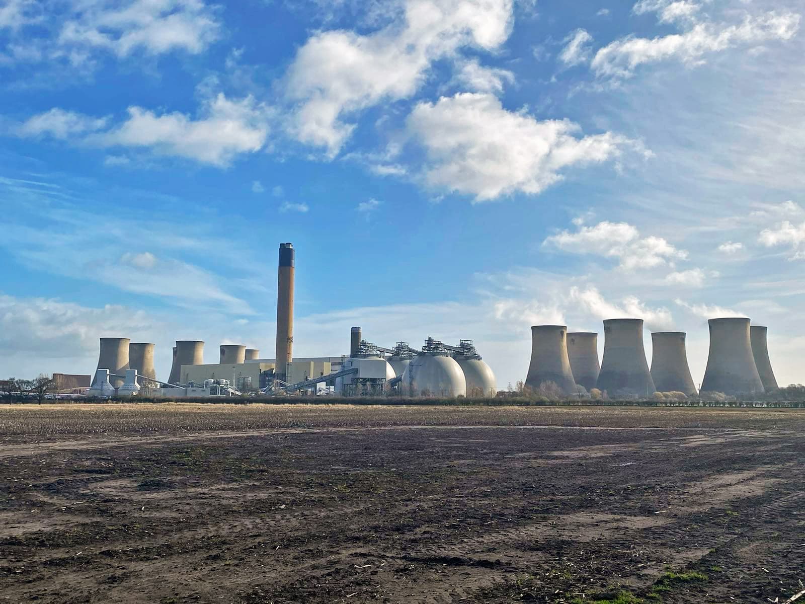 The Drax power plant in North Yorkshire in central England burns about 6.4 million tons of wood pellets per year — equal to roughly two-thirds the pellets produced annually in the U.S. in 2023. Drax is the largest biomass-only energy plant in the world and has received billions in accumulated subsidies from the British government over the past 15 years. Image courtesy of Biofuelwatch and the Environmental Paper Network.