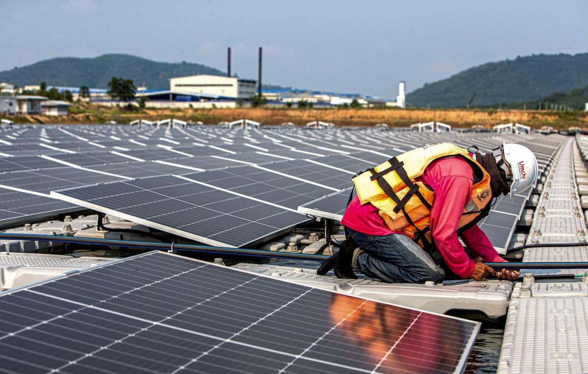 A worker inspects cables at a floating solar power project in Rayong, Thailand. Southeast Asian countries have welcomed investment to produce solar equipment domestically, though this has largely been destined for export to the United States rather than supporting local capacity (Image: Wang Teng / Imago / Alamy)