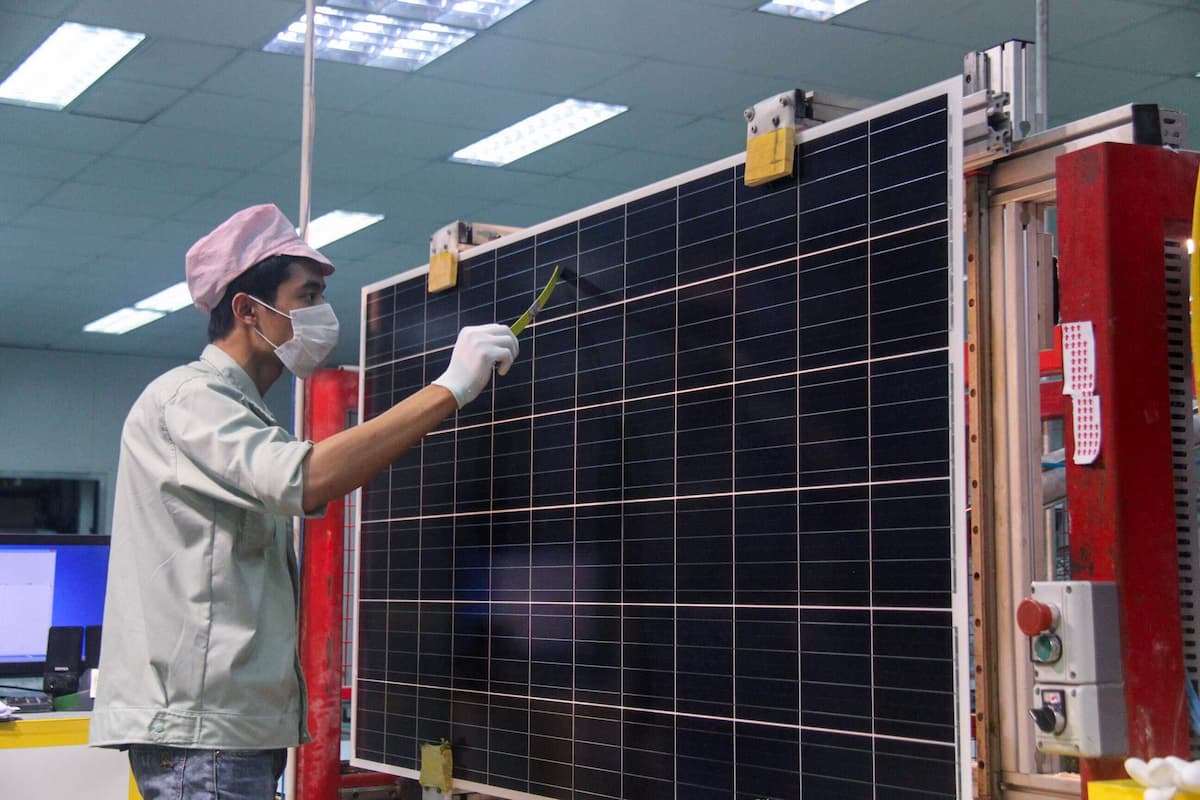 An employee at one of Chinese solar manufacturer Trina Solar’s factories in Vietnam’s Bac Giang province (Image: Imago / Alamy)